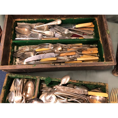 1317 - A large quantity of various odd flatware including Kings pattern, in 2 wood boxes.