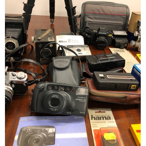 1328 - A large quantity of cameras, including an Olympus OM-2, Pentax P50, Yashica Zoomtec 90, Dacora, Brow... 