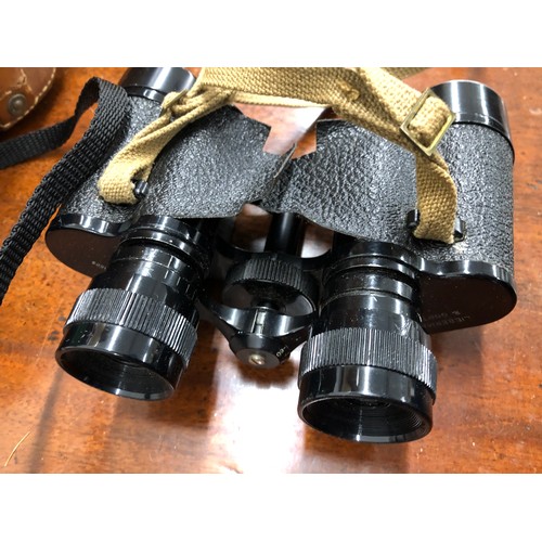 1329 - A pair of Lieberman & Gortz 8 x 32 binoculars (worn) in leather case and another pair of binoculars ... 