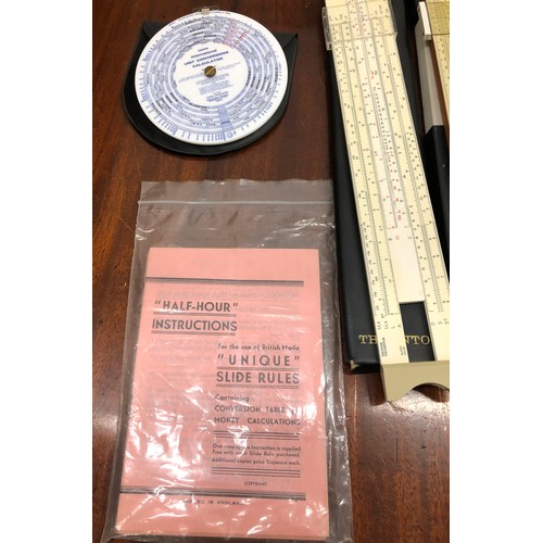 1351 - A quantity of various slide rules, 2 vintage measuring tapes, a protractor set etc.