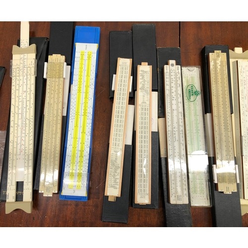 1351 - A quantity of various slide rules, 2 vintage measuring tapes, a protractor set etc.