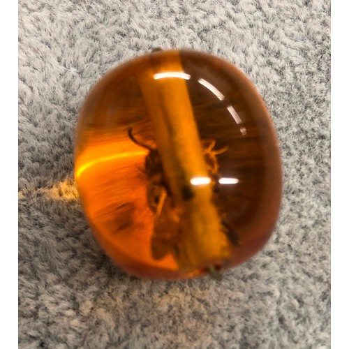 1273 - An amber resin pendant with wasp inside, 3cm long.