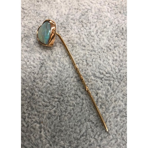 1292 - A Victorian gold  heart shaped opal stick pin, 4.8cm long.