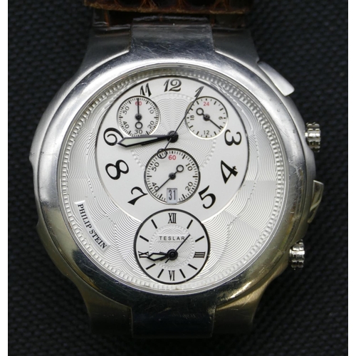 754 - Philip Stein, Teslar circular wristwatch with 2 circular dials inset with 3 smaller dials and leathe... 