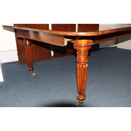 989 - A Large 19th century mahogany key wind dining table with 3 extra leaves (leaves later) 308cm x 146cm... 