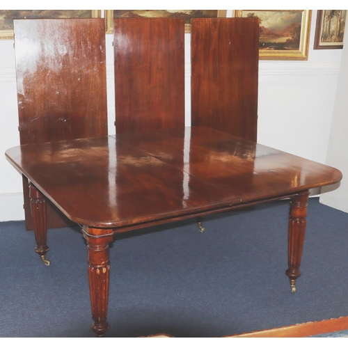 989 - A Large 19th century mahogany key wind dining table with 3 extra leaves (leaves later) 308cm x 146cm... 