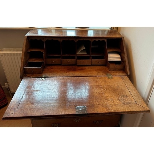 1398 - A George III oak bureau, good condition, but no keys, and a brass handle missing from one of the dra... 