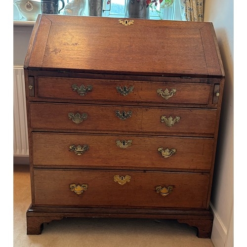 1398 - A George III oak bureau, good condition, but no keys, and a brass handle missing from one of the dra... 