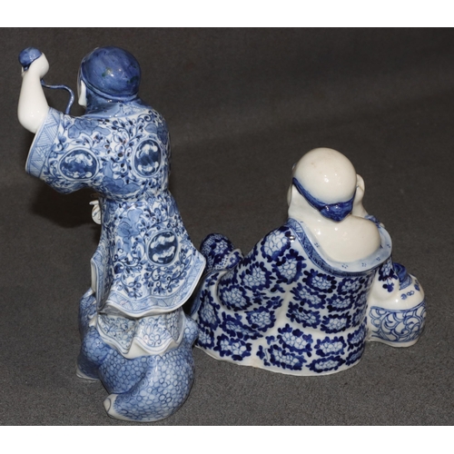 157 - 2 Oriental blue and white china figures of  a gentleman standing on a toad, 29.5cm high and a seated... 