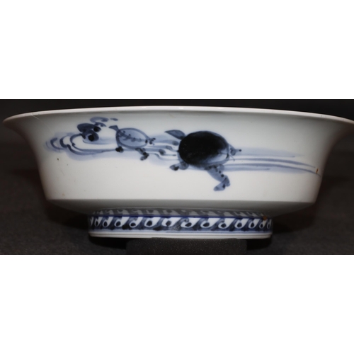 169 - An Oriental blue and white round trumpet shaped bowl depicting stork, floral and branch decoration, ... 