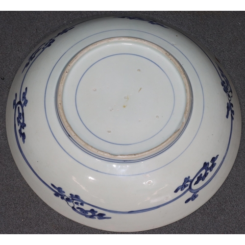 171 - An 18th/19th Century Chinese round bowl on blue and white ground with floral and leaf decoration, 32... 