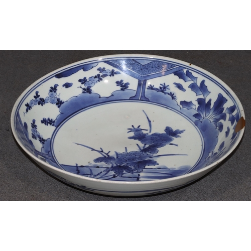 171 - An 18th/19th Century Chinese round bowl on blue and white ground with floral and leaf decoration, 32... 