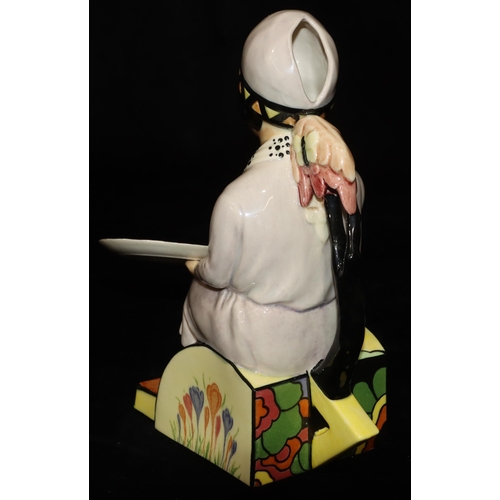 19 - A Kevin Francis Ceramics limited edition Clarice Cliff jug in the form of a seated lady painting a p... 