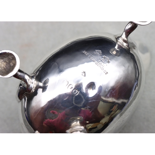 250 - A Victorian small silver sauceboat with crinkle rim, scroll handle and splayed shell shaped feet, Lo... 