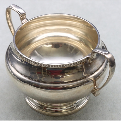 251 - A George V silver round bulbous shaped 2-handled sugar bowl, London 1932, maker Goldsmiths & Silvers... 