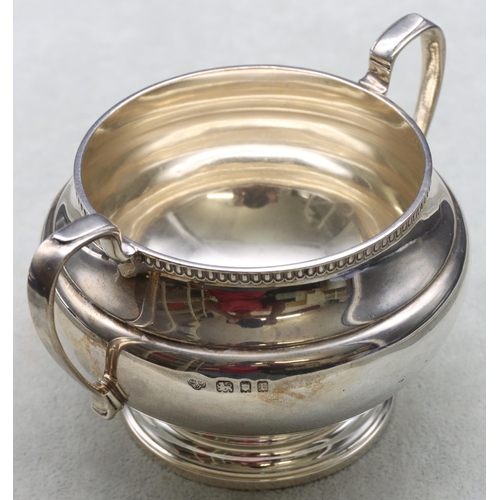 251 - A George V silver round bulbous shaped 2-handled sugar bowl, London 1932, maker Goldsmiths & Silvers... 