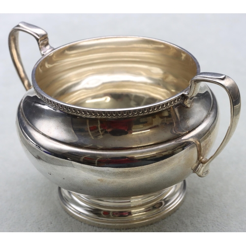 251 - A George V silver round bulbous shaped 2-handled sugar bowl, London 1932, maker Goldsmiths & Silvers... 