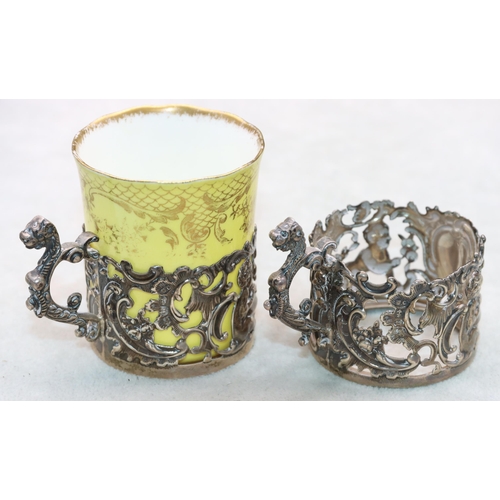 292 - A pair of Birmingham silver cup holders with embossed cupid, leaf and scroll decoration, 1 mounted w... 