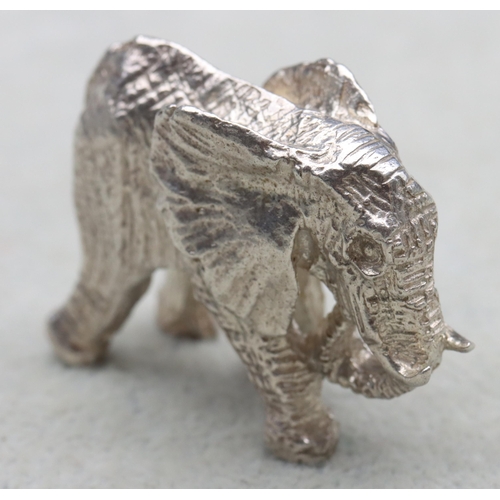 295 - A small solid silver figure of an elephant, 4.5cm wide, 1.6oz