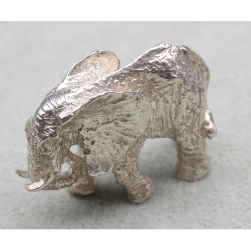 295 - A small solid silver figure of an elephant, 4.5cm wide, 1.6oz