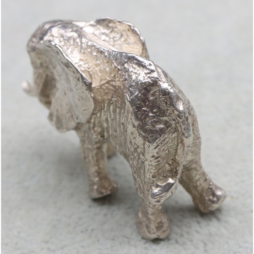 295 - A small solid silver figure of an elephant, 4.5cm wide, 1.6oz