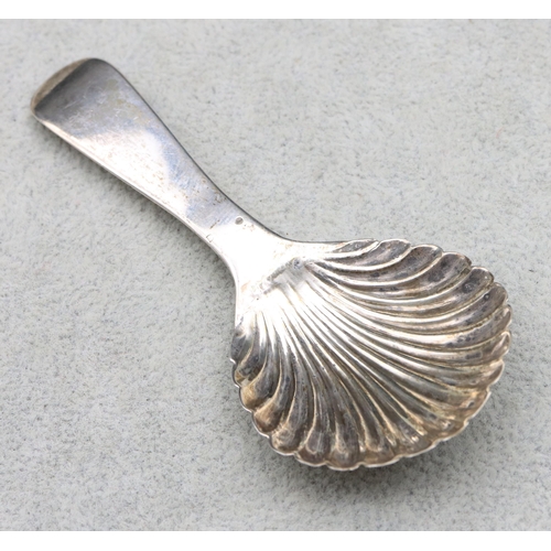 302 - A George III silver caddy spoon with shell shaped bowl, London 1811 (maker's mark rubbed)