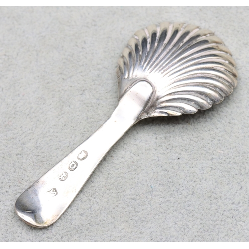 302 - A George III silver caddy spoon with shell shaped bowl, London 1811 (maker's mark rubbed)