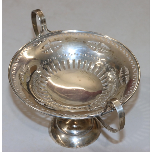 306 - An Edward VII silver round 2-handled sweet meat dish with pierced decoration on round sweeping foot,... 