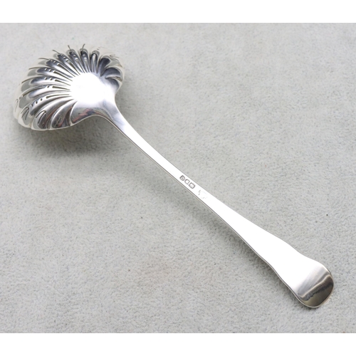 311 - An Edward VII silver sifter spoon with shell shaped bowl, London 1909, 0.99oz