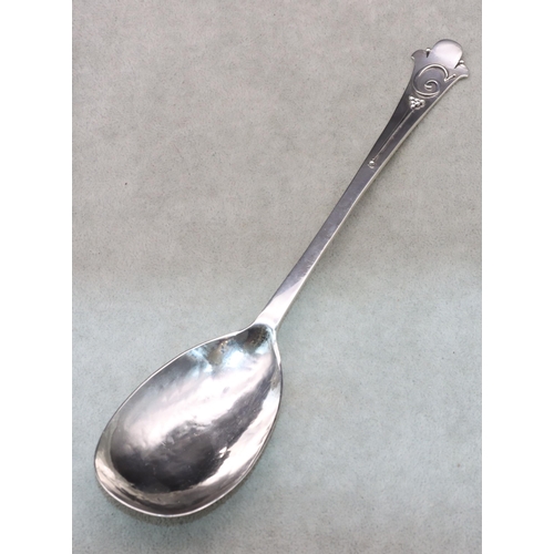 312 - An Arts & Crafts silver spoon with hammered bowl and raised Fleur de Lys finial, Sheffield 1926, mak... 