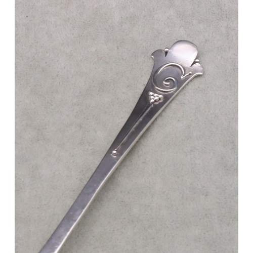 312 - An Arts & Crafts silver spoon with hammered bowl and raised Fleur de Lys finial, Sheffield 1926, mak... 