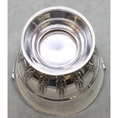 313 - An Edward VII silver round trumpet shaped bowl with swing overhead handle, part raised floral and sc... 