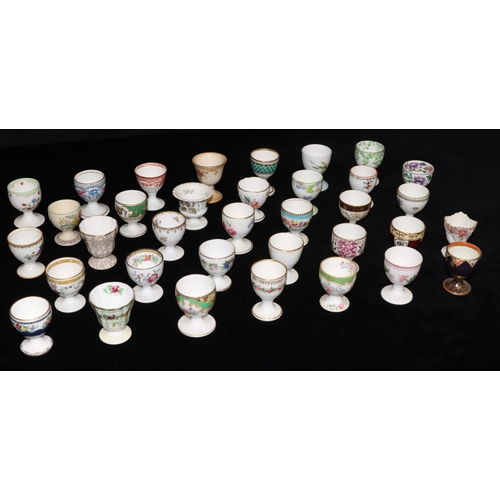 33 - 35 various china and other egg cups