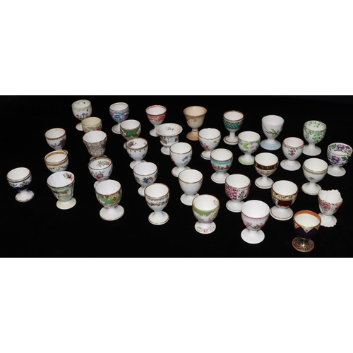 33 - 35 various china and other egg cups