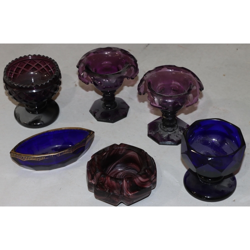 38 - A pair of 19th Century purple glass round salts with scallop shaped rims on hexagonal bases, 9cm hig... 