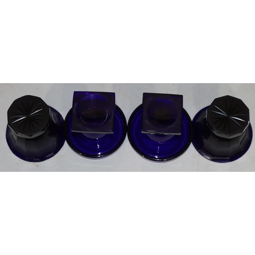 39 - A pair of Georgian Bristol blue glass round trumpet shaped salts with chamfer decoration, on sweepin... 