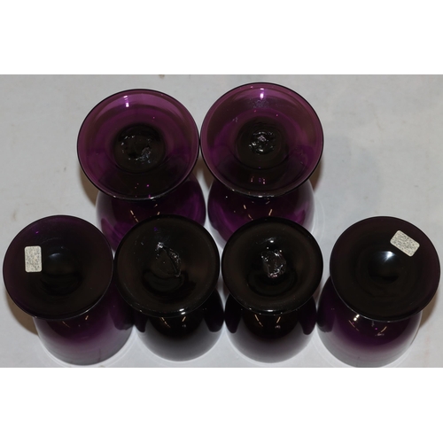 41 - A pair of 18th/19th Century purple glasses on knob stems with round sweeping bases, 14.5cm high and ... 