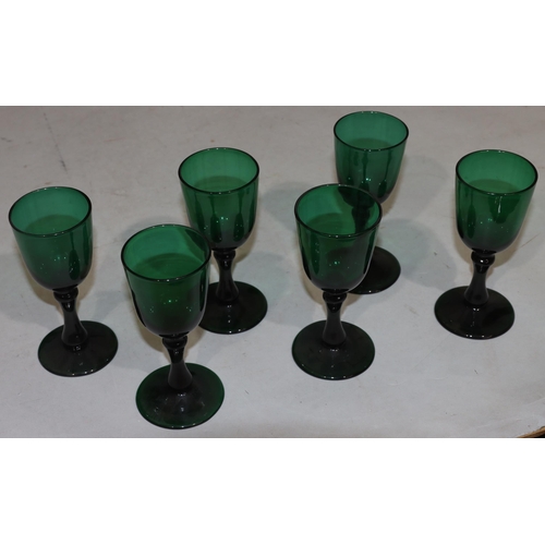 44 - A pair of heavy Bristol aquamarine coloured drinking glasses on round bases, 12.5cm high and 4 simil... 