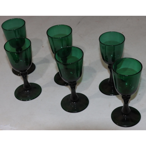 44 - A pair of heavy Bristol aquamarine coloured drinking glasses on round bases, 12.5cm high and 4 simil... 