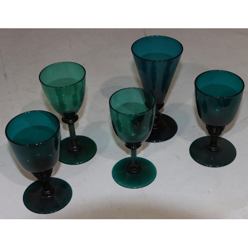 46 - 2 Georgian Bristol green glasses with raised dimple and triangular decoration on round bases, larges... 