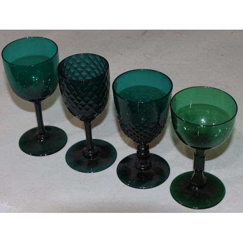 47 - A 4 Georgian Bristol green glass bulbous shaped drinking glasses on round bases largest 13.7cm high