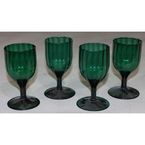 47 - A 4 Georgian Bristol green glass bulbous shaped drinking glasses on round bases largest 13.7cm high