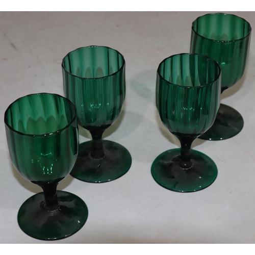 47 - A 4 Georgian Bristol green glass bulbous shaped drinking glasses on round bases largest 13.7cm high