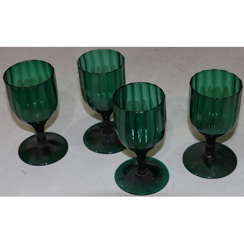 47 - A 4 Georgian Bristol green glass bulbous shaped drinking glasses on round bases largest 13.7cm high