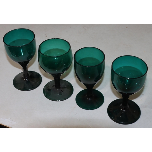 49 - A pair of Georgian Bristol green round bulbous shaped glasses with chamfer stems on round bases, 12.... 