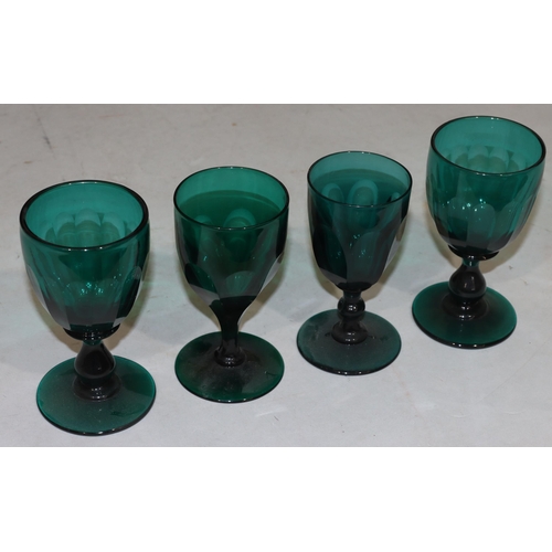 50 - A pair of Georgian Bristol green glasses with chamfer pattern decoration with bulbous stems on round... 