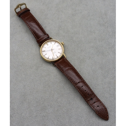 509 - A gentlemen's Rotary 21 jewels automatic circular wristwatch with seconds hand and calendar, brown l... 