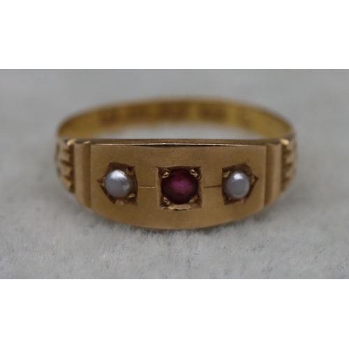 513 - A 22ct gold signet ring mounted with centre ruby flanked by 2 half pearls, Size L/M, 1.8 grams gross