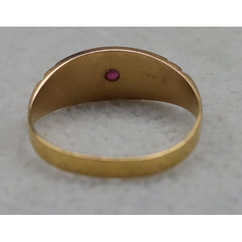 513 - A 22ct gold signet ring mounted with centre ruby flanked by 2 half pearls, Size L/M, 1.8 grams gross