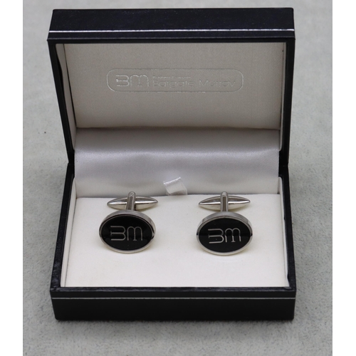 515 - A pair of Bargate Murray gentlemen's oval cufflinks with monogram motifs, in fitted leather case